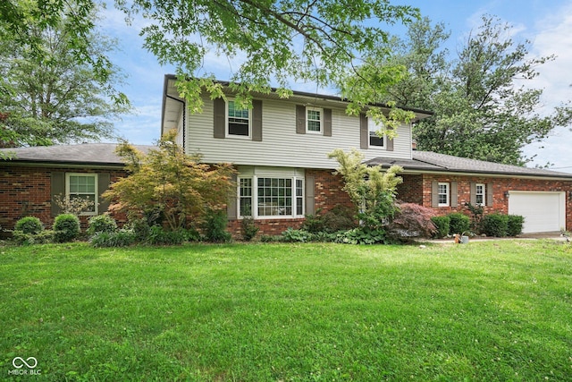 925 W Hancock Rd, Scottsburg, IN 47170 - view of front of property with an attached garage, brick siding, and a front yard