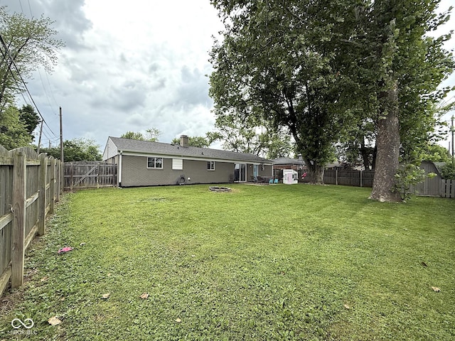 729 Maple Ln, Brownsburg, IN 46112 - fenced backyard featuring a storage unit