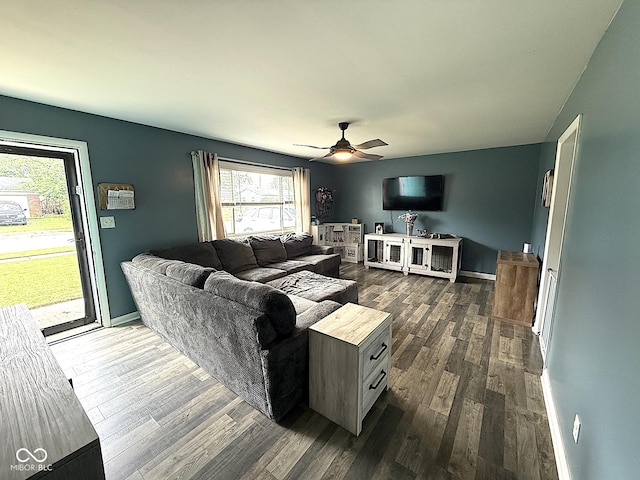 729 Maple Ln, Brownsburg, IN 46112 - living room featuring a ceiling fan and dark wood-style flooring