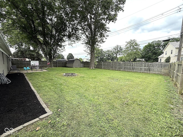 729 Maple Ln, Brownsburg, IN 46112 - fenced backyard with a patio, a shed, and a fire pit