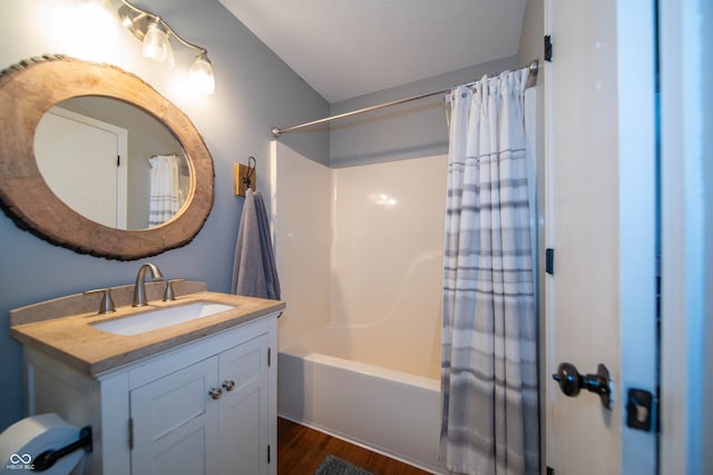 4238 Victory Ct, Indianapolis, IN 46203 - bathroom with vanity, shower / bath combination with curtain, and wood finished floors