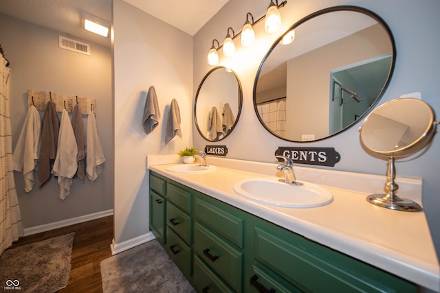 4238 Victory Ct, Indianapolis, IN 46203 - bathroom featuring double vanity and wood finished floors