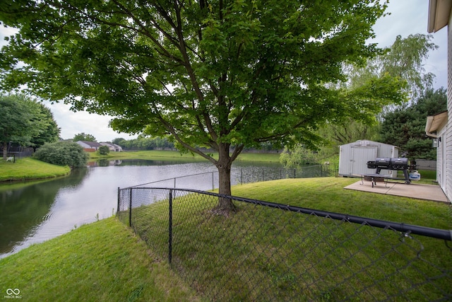 4238 Victory Ct, Indianapolis, IN 46203 - fenced backyard featuring a shed, a water view, and a patio area