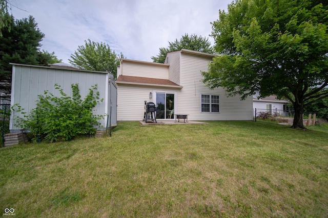 4238 Victory Ct, Indianapolis, IN 46203 - rear view of house featuring a storage shed and a patio area