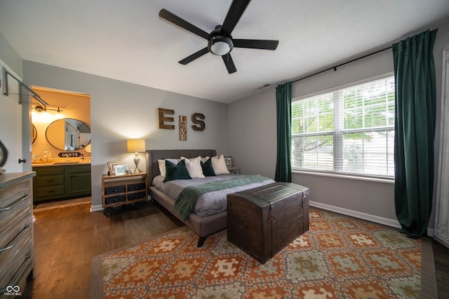 4238 Victory Ct, Indianapolis, IN 46203 - bedroom featuring wood finished floors, ensuite bath, and a ceiling fan
