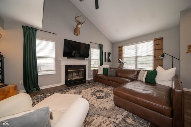 4238 Victory Ct, Indianapolis, IN 46203 - living room with a ceiling fan, a fireplace with flush hearth, high vaulted ceiling, and wood finished floors
