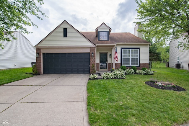 4238 Victory Ct, Indianapolis, IN 46203 - view of front of home featuring brick siding, a garage, a front lawn, driveway, and a chimney