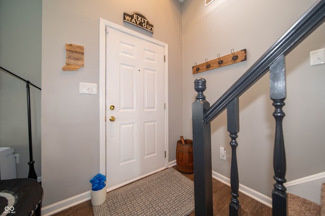 4238 Victory Ct, Indianapolis, IN 46203 - foyer featuring dark wood-style flooring and stairs
