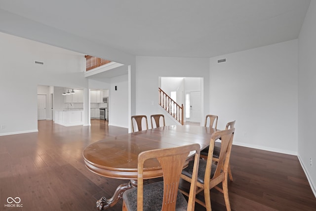 2078 Seneca Ln, Plainfield, IN 46168 - dining space featuring wood finished floors and stairs