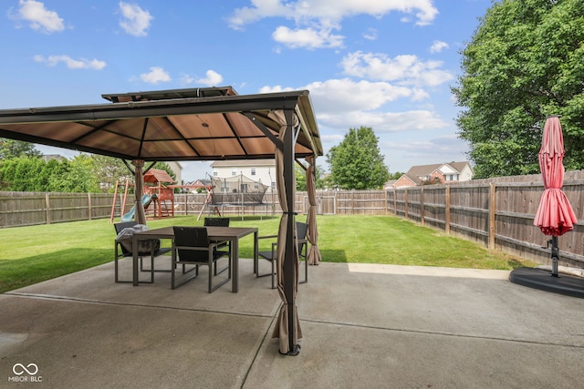 2078 Seneca Ln, Plainfield, IN 46168 - fenced backyard with a playground, a patio, a trampoline, and outdoor dining area
