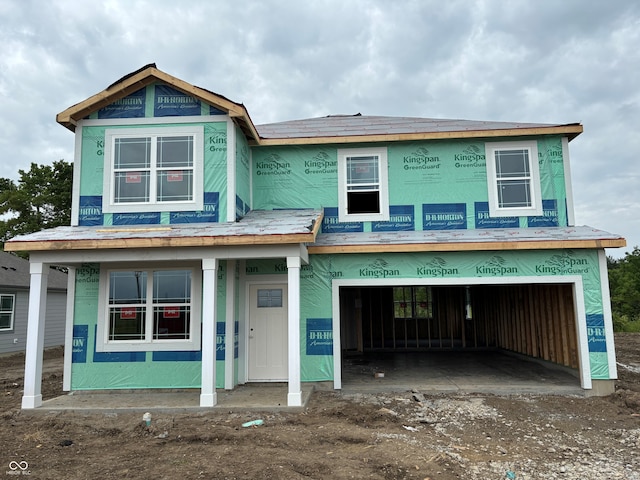 9334 Hemingway Dr, Indianapolis, IN 46239 - property in mid-construction featuring an attached garage and driveway