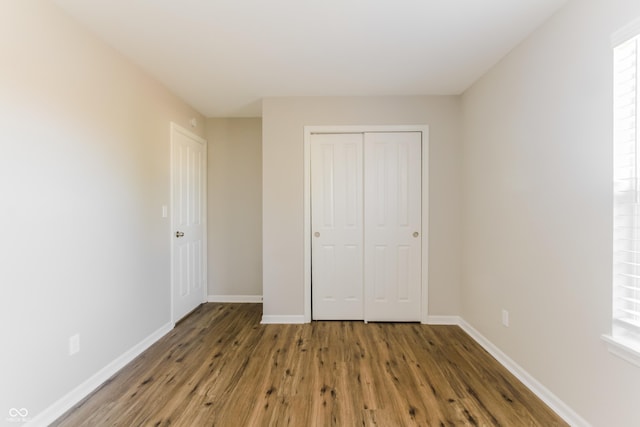 413 Youngs Creek Ct, Franklin, IN 46131 - unfurnished bedroom with wood finished floors and a closet