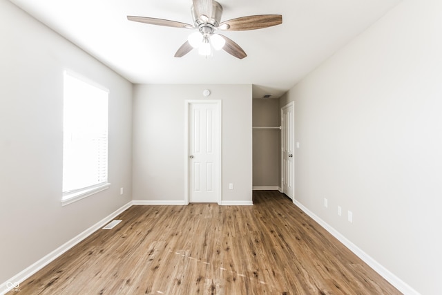 413 Youngs Creek Ct, Franklin, IN 46131 - unfurnished bedroom featuring wood finished floors, a closet, and a ceiling fan