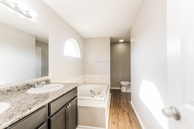 413 Youngs Creek Ct, Franklin, IN 46131 - bathroom featuring a bath, double vanity, and wood finished floors
