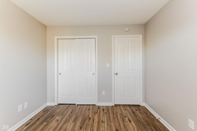 413 Youngs Creek Ct, Franklin, IN 46131 - unfurnished bedroom featuring a closet and dark wood-type flooring