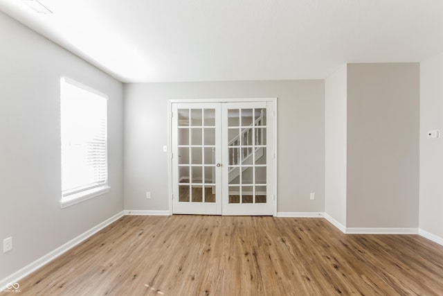 413 Youngs Creek Ct, Franklin, IN 46131 - spare room featuring french doors and wood finished floors