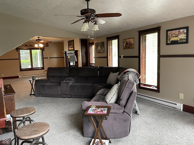 14380 N 300 E, Covington, IN 47932 - carpeted living room featuring ceiling fan, a baseboard heating unit, a textured ceiling, and lofted ceiling
