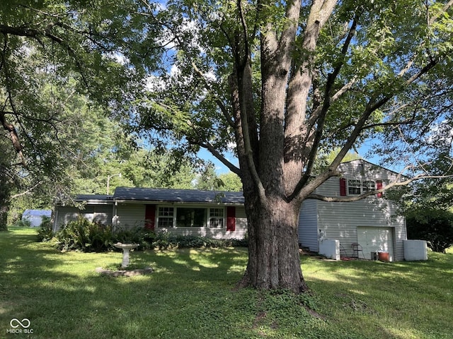 4633 S County Road 500 E, Plainfield, IN 46168 - view of front of home with a front yard and a garage