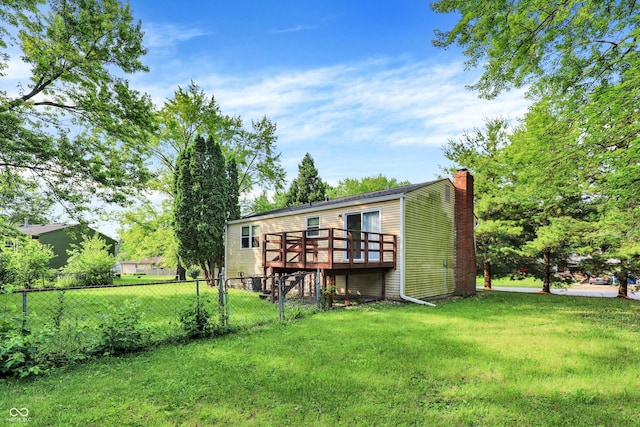 8920 Caminito Rd, Indianapolis, IN 46234 - rear view of house featuring a deck and a chimney