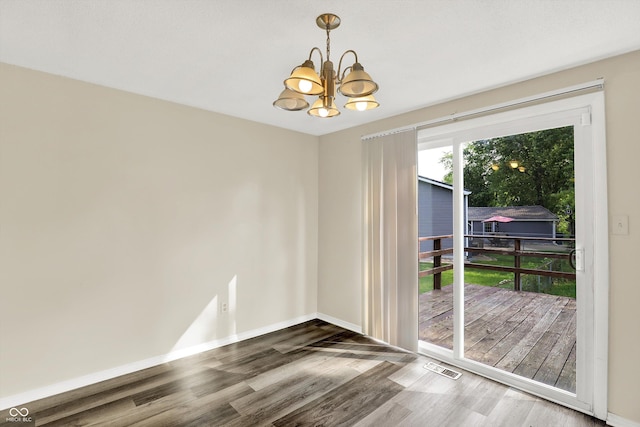 8920 Caminito Rd, Indianapolis, IN 46234 - unfurnished dining area with a chandelier and wood finished floors