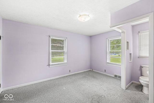 4010 S Bazil Ave, Indianapolis, IN 46239 - unfurnished room featuring carpet flooring and a textured ceiling