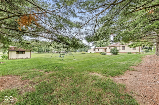 4010 S Bazil Ave, Indianapolis, IN 46239 - view of grassy yard featuring a storage shed