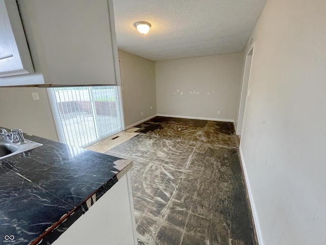 5667 Broyles Rd, Avon, IN 46123 - unfurnished dining area featuring a textured ceiling and a sink