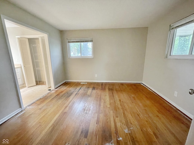 5667 Broyles Rd, Avon, IN 46123 - unfurnished bedroom with wood-type flooring and baseboards