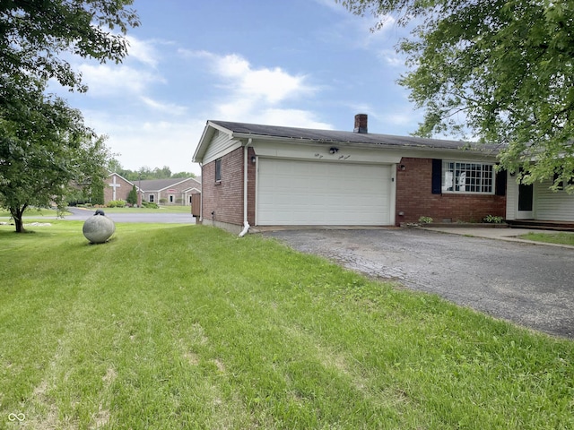 5667 Broyles Rd, Avon, IN 46123 - view of front facade featuring brick siding, a garage, asphalt driveway, a front lawn, and a chimney
