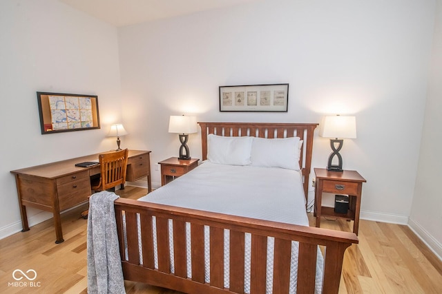 355 E Ohio St Unit 211, Indianapolis, IN 46204 - bedroom with wood finished floors and baseboards
