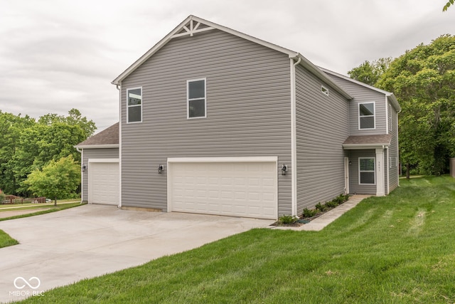 3541 N Hackberry St N, Bloomington, IN 47404 - view of home's exterior with a lawn, driveway, and a garage