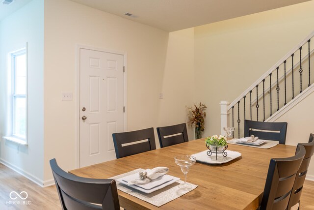 3541 N Hackberry St N, Bloomington, IN 47404 - dining room with light wood-style flooring and stairs
