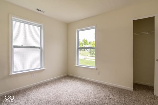 3541 N Hackberry St N, Bloomington, IN 47404 - unfurnished bedroom with carpet, a closet, and a spacious closet