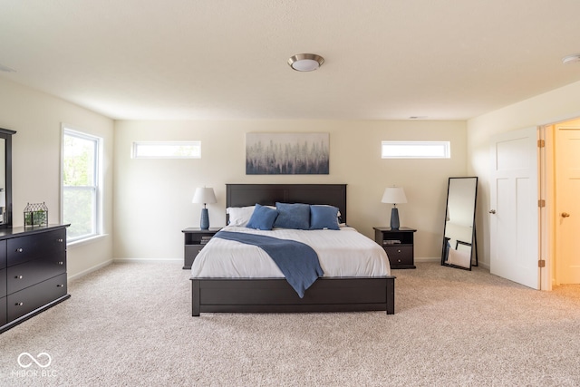 3541 N Hackberry St N, Bloomington, IN 47404 - bedroom featuring light carpet and multiple windows