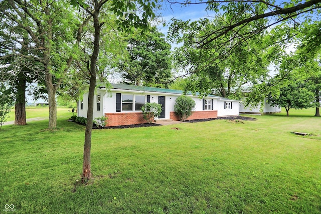 12471 N 100 E, Alexandria, IN 46001 - view of front facade featuring brick siding and a front lawn