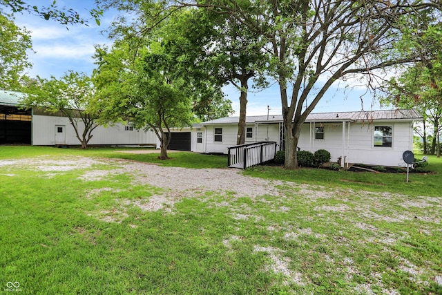 12471 N 100 E, Alexandria, IN 46001 - rear view of house with a yard and a metal roof