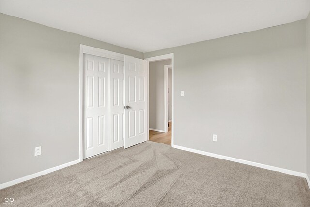 12471 N 100 E, Alexandria, IN 46001 - unfurnished bedroom featuring carpet flooring and a closet
