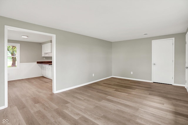 12471 N 100 E, Alexandria, IN 46001 - unfurnished room with light wood-style flooring and wainscoting