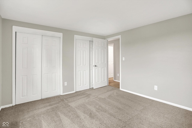 12471 N 100 E, Alexandria, IN 46001 - unfurnished bedroom with multiple closets and carpet flooring
