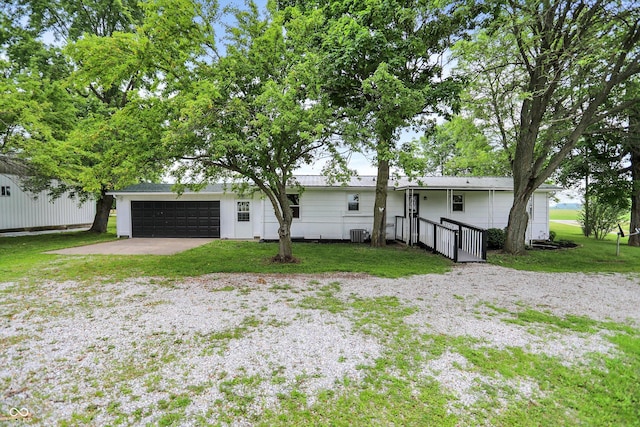 12471 N 100 E, Alexandria, IN 46001 - rear view of property with driveway, a yard, and a garage