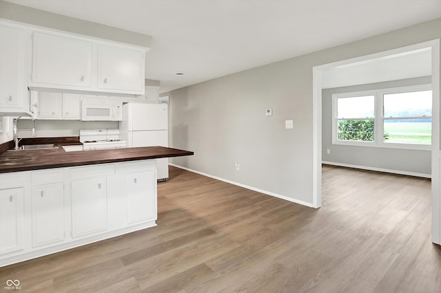 12471 N 100 E, Alexandria, IN 46001 - kitchen featuring white appliances, wooden counters, light wood finished floors, and white cabinetry