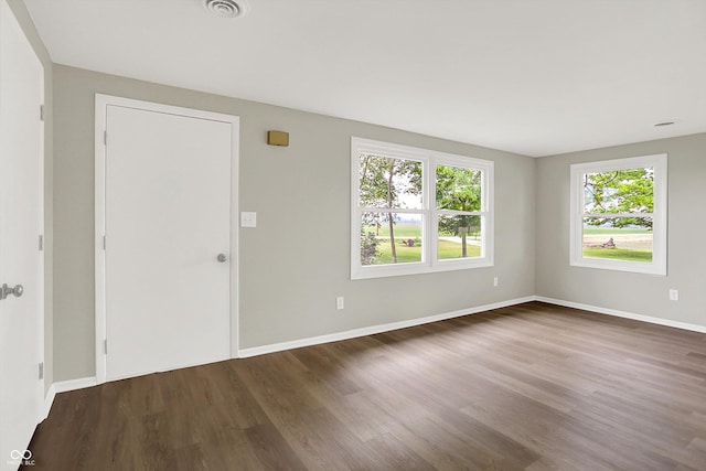 12471 N 100 E, Alexandria, IN 46001 - spare room featuring healthy amount of natural light and dark wood-style floors