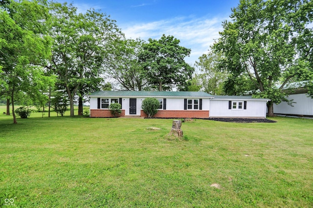 12471 N 100 E, Alexandria, IN 46001 - view of front of home with a front yard, a metal roof, and brick siding