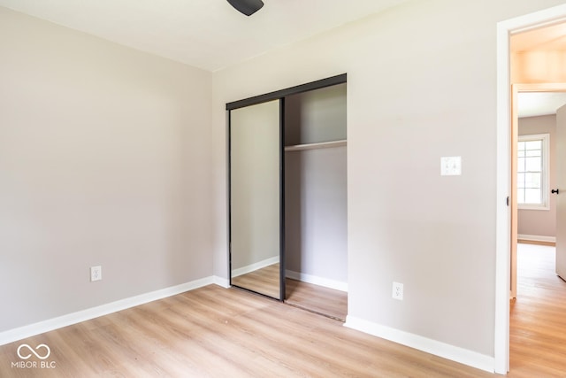 3212 S Fairington Dr, Bloomington, IN 47403 - unfurnished bedroom with light wood-type flooring and a closet