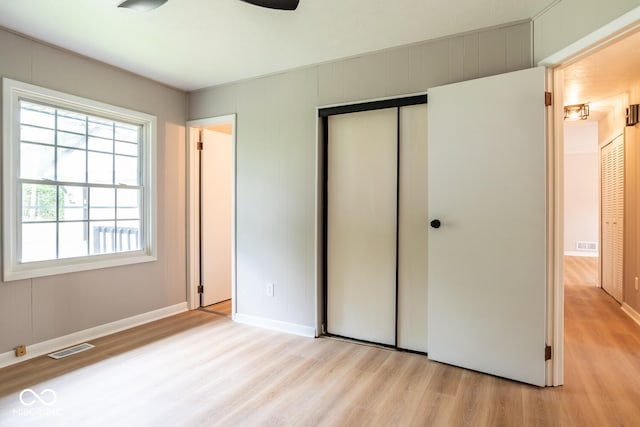 3212 S Fairington Dr, Bloomington, IN 47403 - unfurnished bedroom with light wood-style flooring and a closet