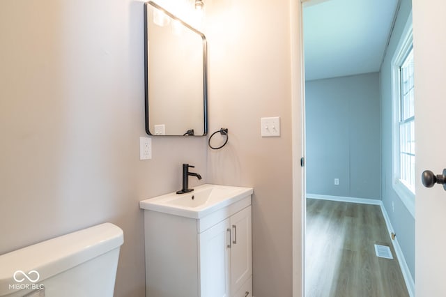 3212 S Fairington Dr, Bloomington, IN 47403 - bathroom featuring vanity, wood finished floors, and plenty of natural light