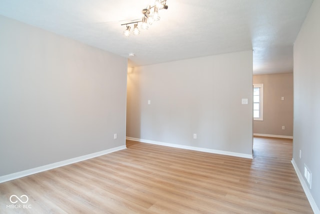 3212 S Fairington Dr, Bloomington, IN 47403 - unfurnished room with light wood finished floors and baseboards