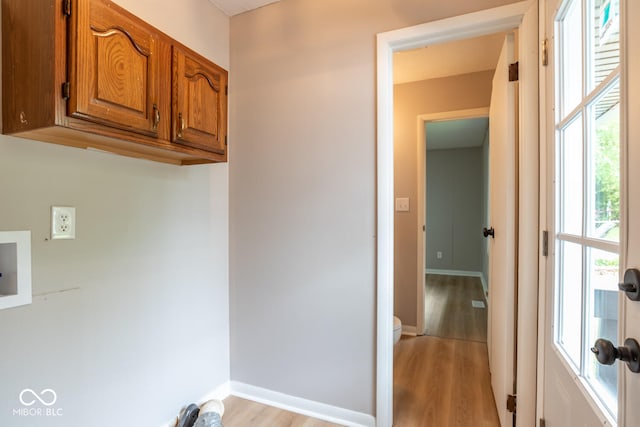 3212 S Fairington Dr, Bloomington, IN 47403 - laundry room with cabinet space, light wood-style flooring, and washer hookup