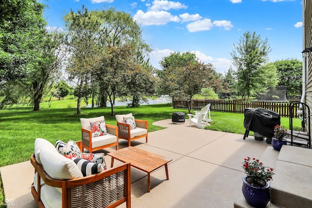 13191 Roma, Carmel, IN 46074 - view of patio featuring a trampoline, a grill, and an outdoor living space with a fire pit