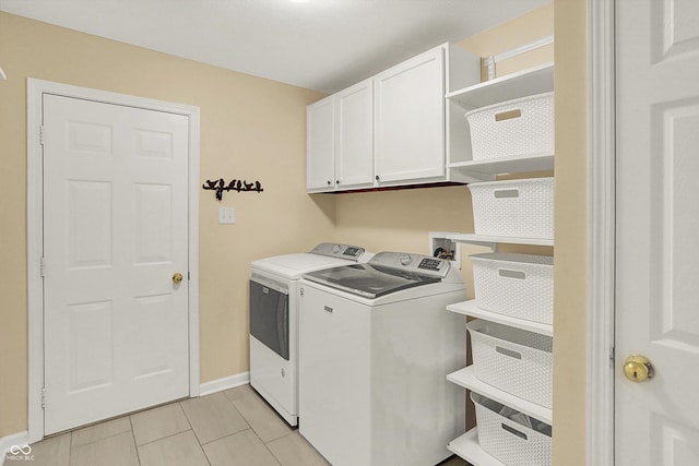 13191 Roma, Carmel, IN 46074 - laundry room with washing machine and clothes dryer, light tile patterned floors, and cabinet space